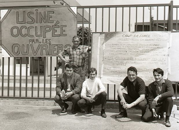 french workers with placard during occupation of their factory